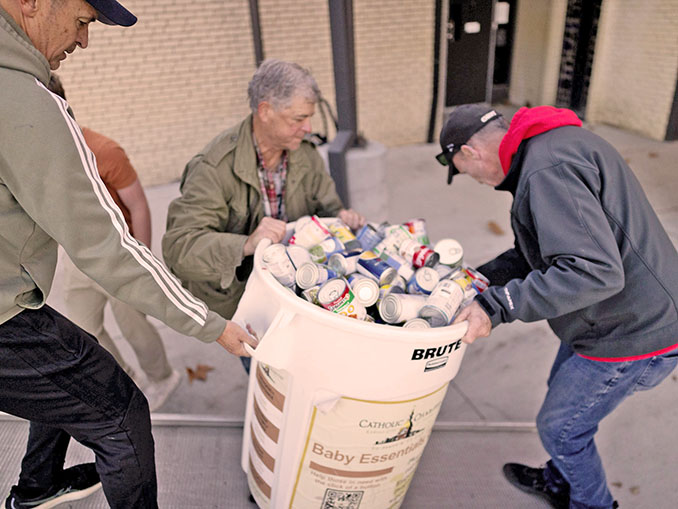 Volunteers collect food for Catholic Charities