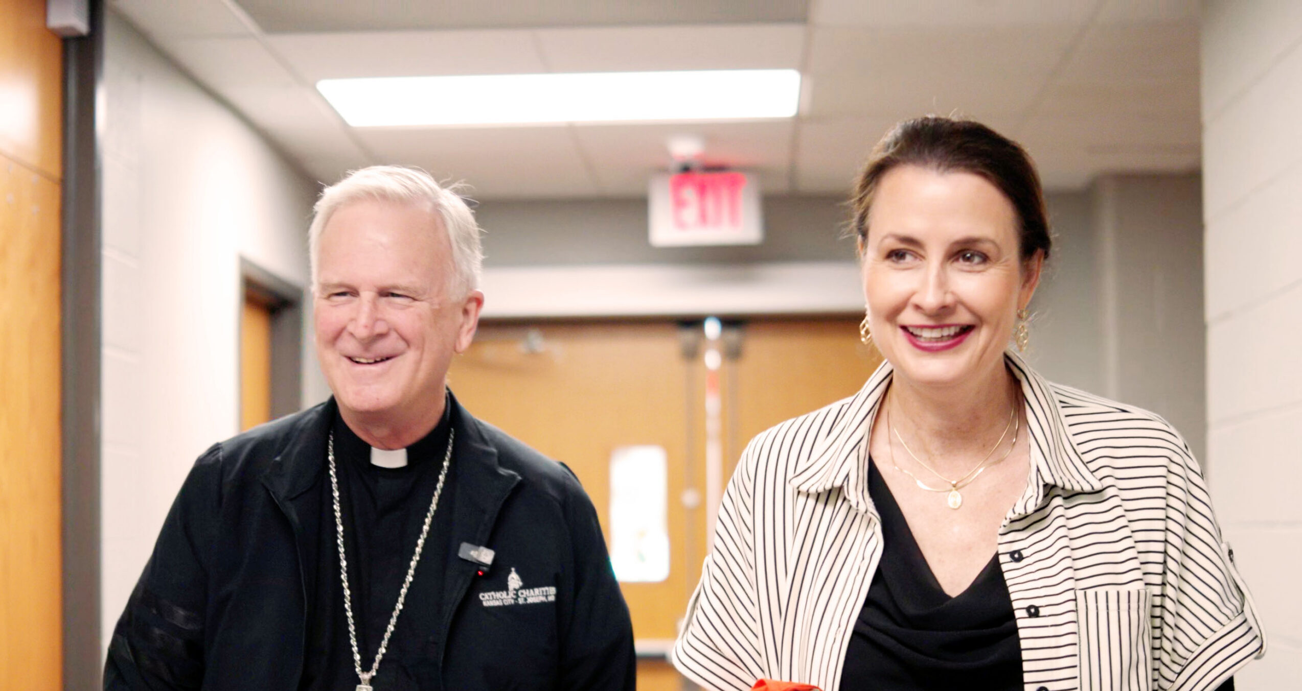 Bishop and CEO in hallway