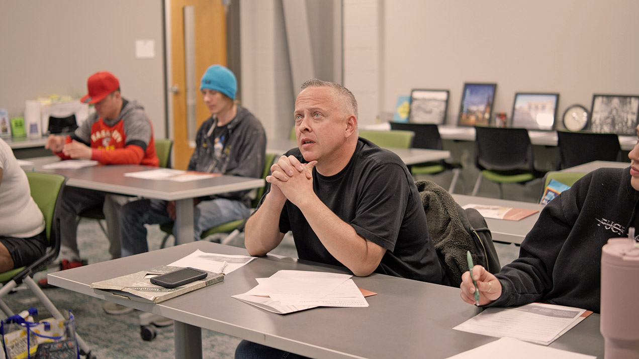 Men in a classroom setting