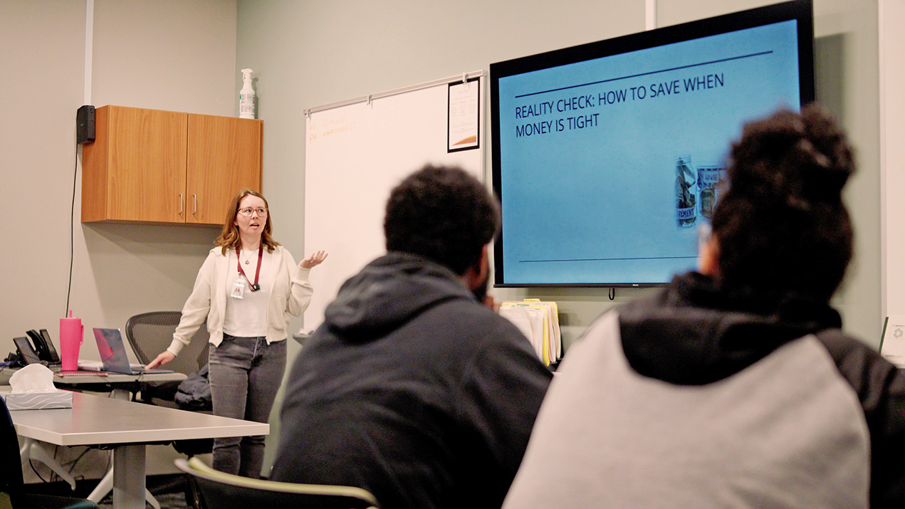 Woman teaching about saving money