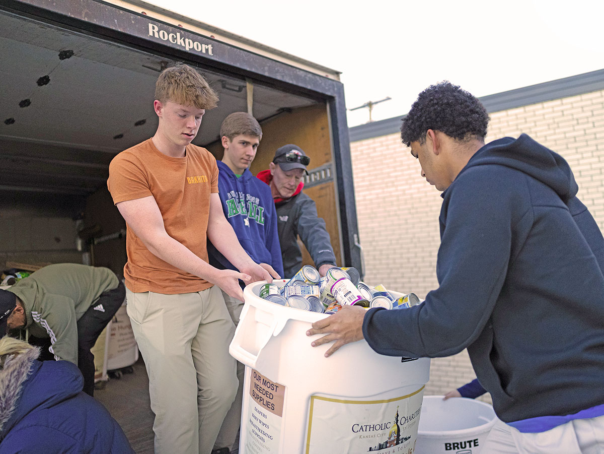 Teens unload canned food donation