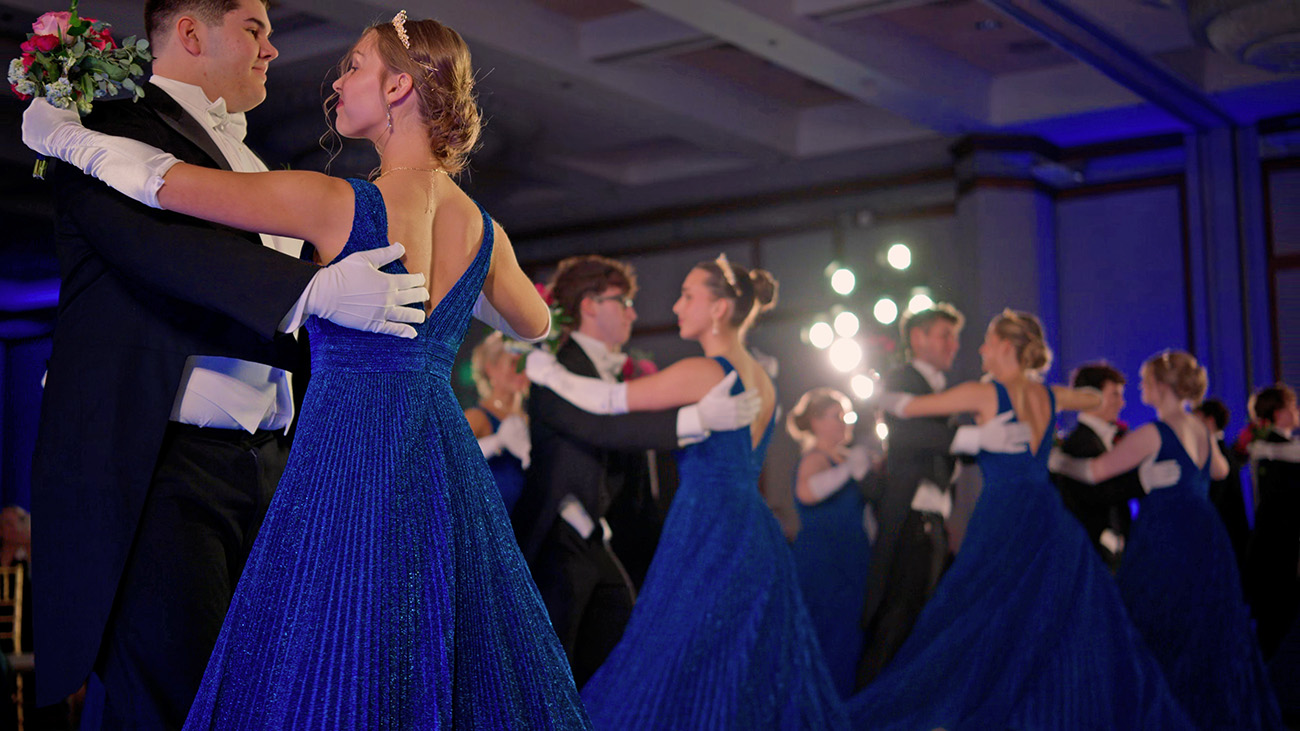 Couples dancing at a formal ball