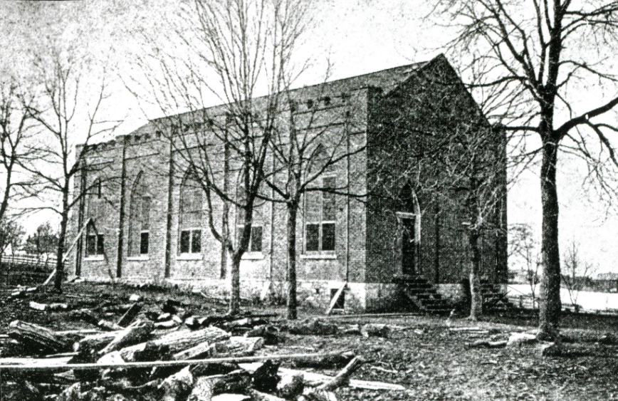 Old brick church with bare trees