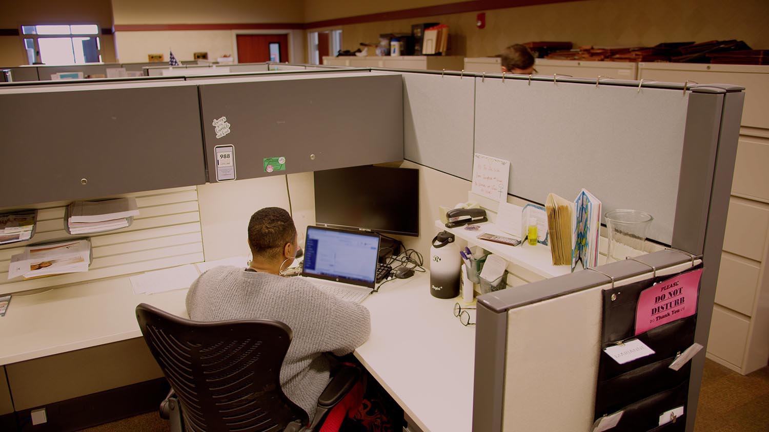 Woman working in a cubicle