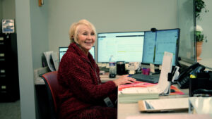 Woman working at computer desk