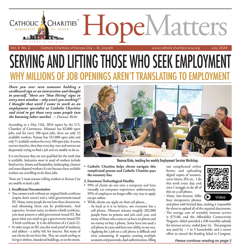 Catholic Charities staff help woman with job search.
