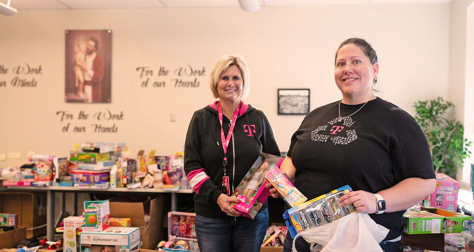 Two women holding toys for Shining Star