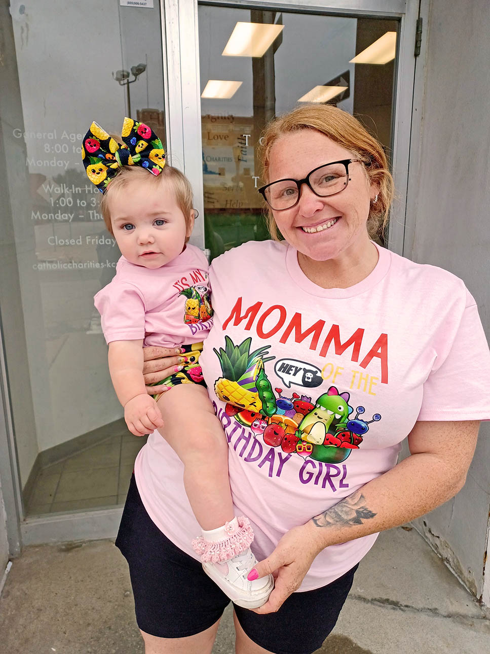Mom and baby in matching birthday shirts