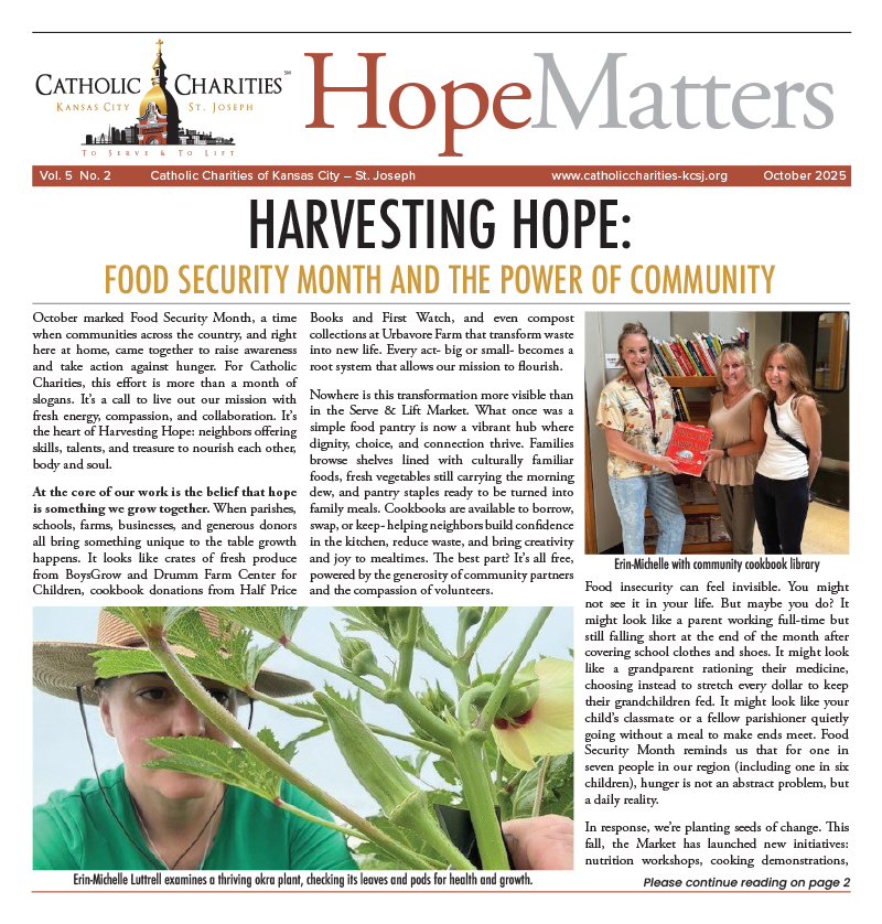 Erin-Michelle Luttrell examines okra plant