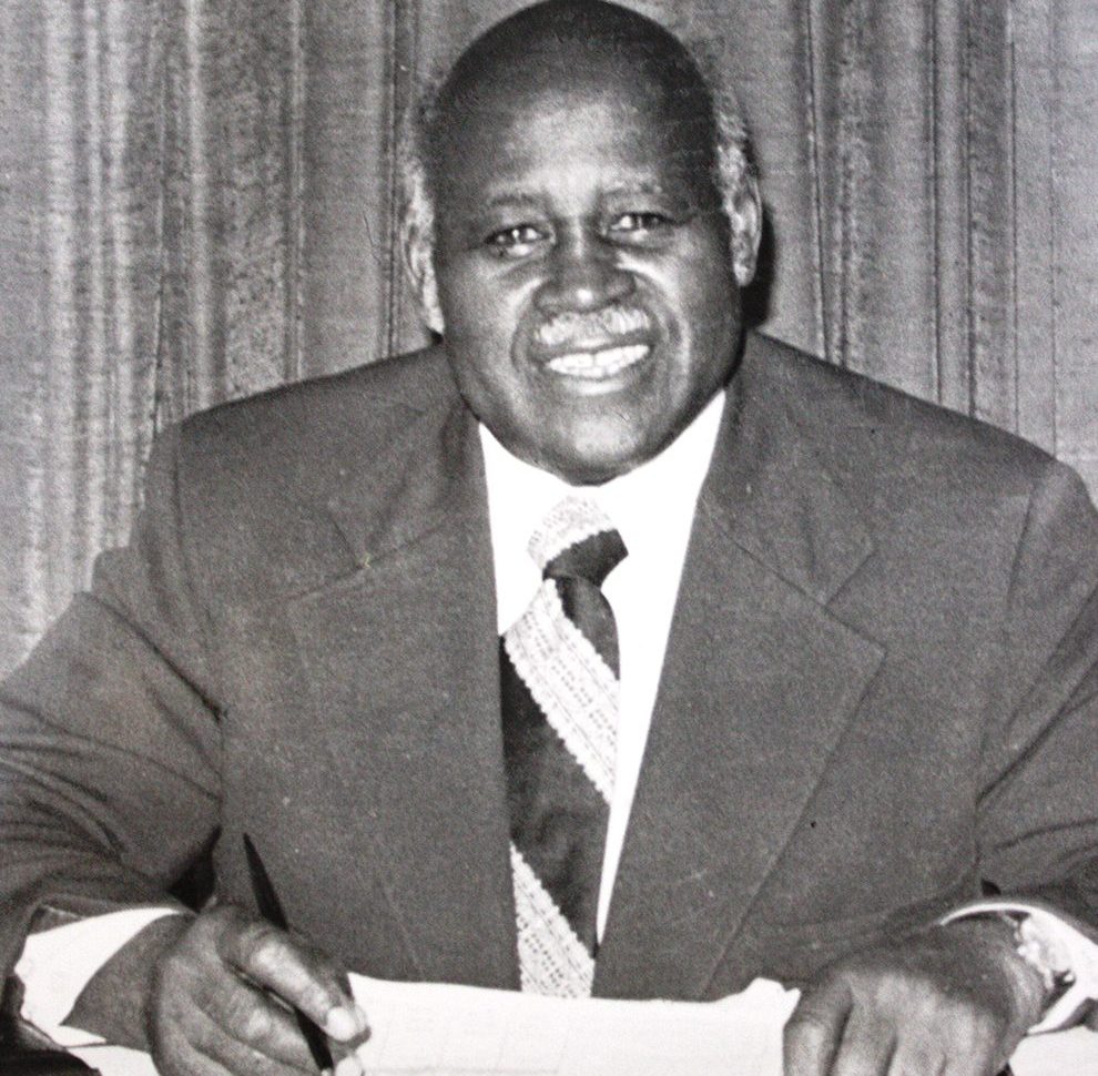 Man in suit smiles