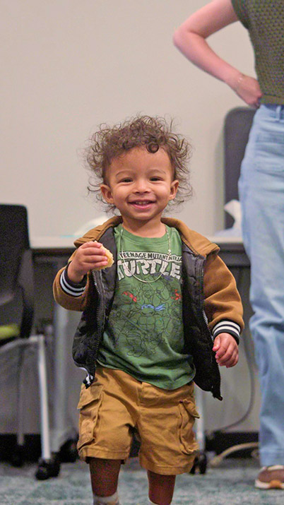 Toddler boy in Teenage Mutant Ninja Turtles shirt