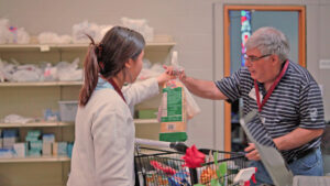 Volunteers help with food bank donations