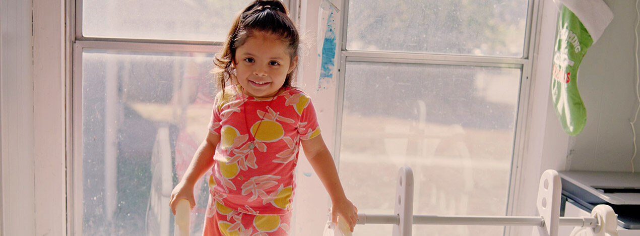 Girl in lemon pajamas on slide