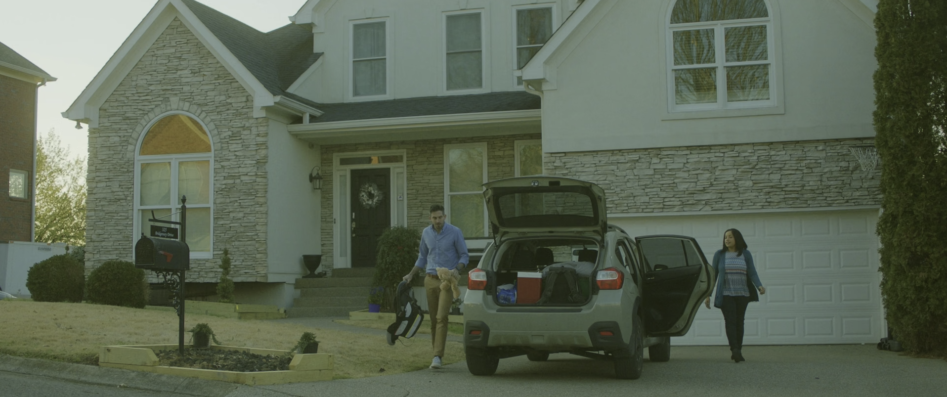 Couple loading car for trip