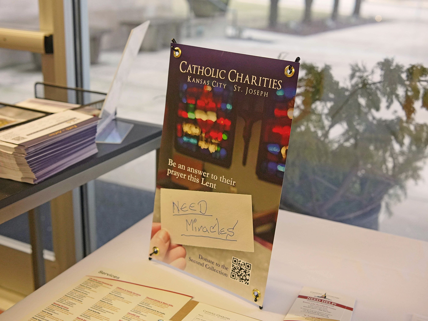 Catholic Charities donation sign during Lent