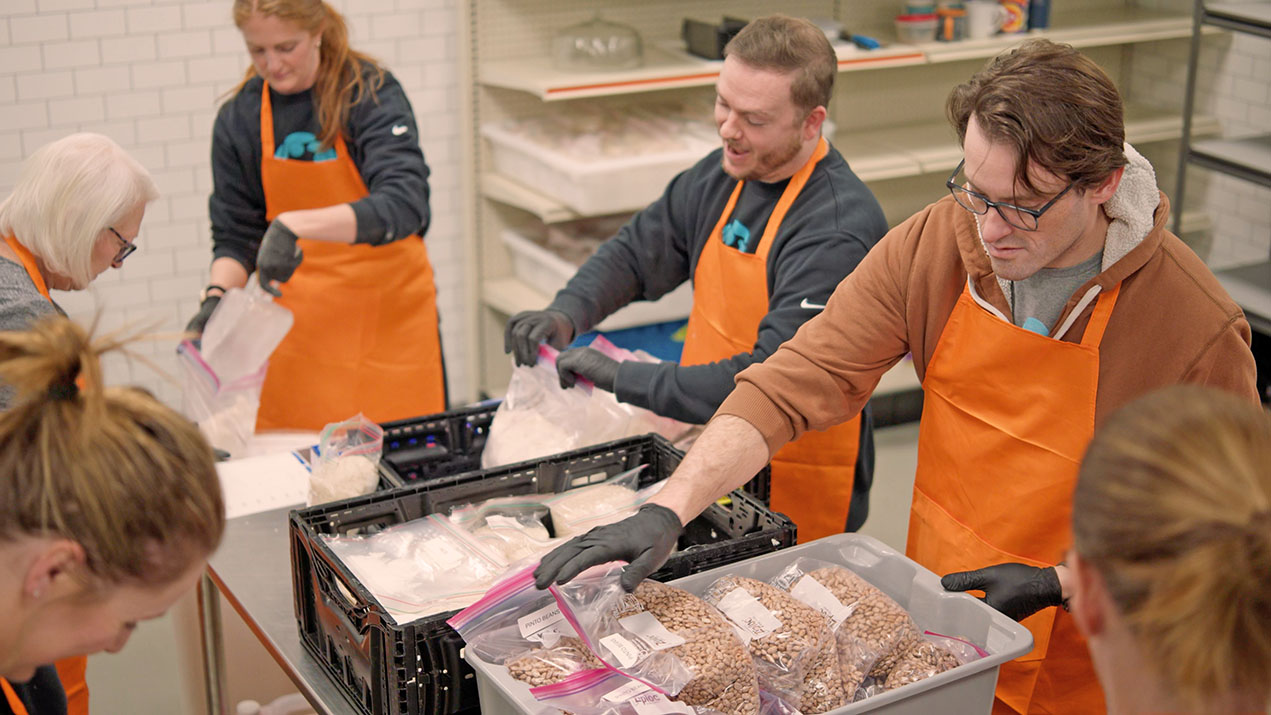 Volunteers package food donations