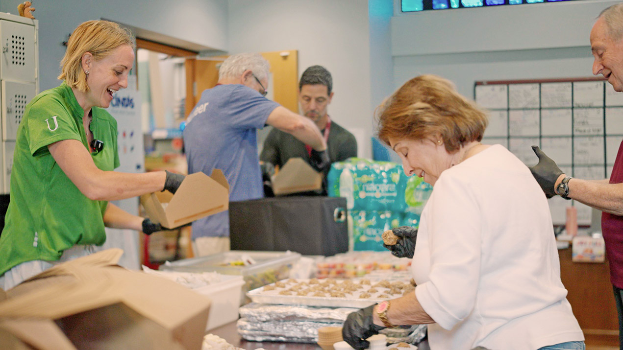 Volunteers packing food donations
