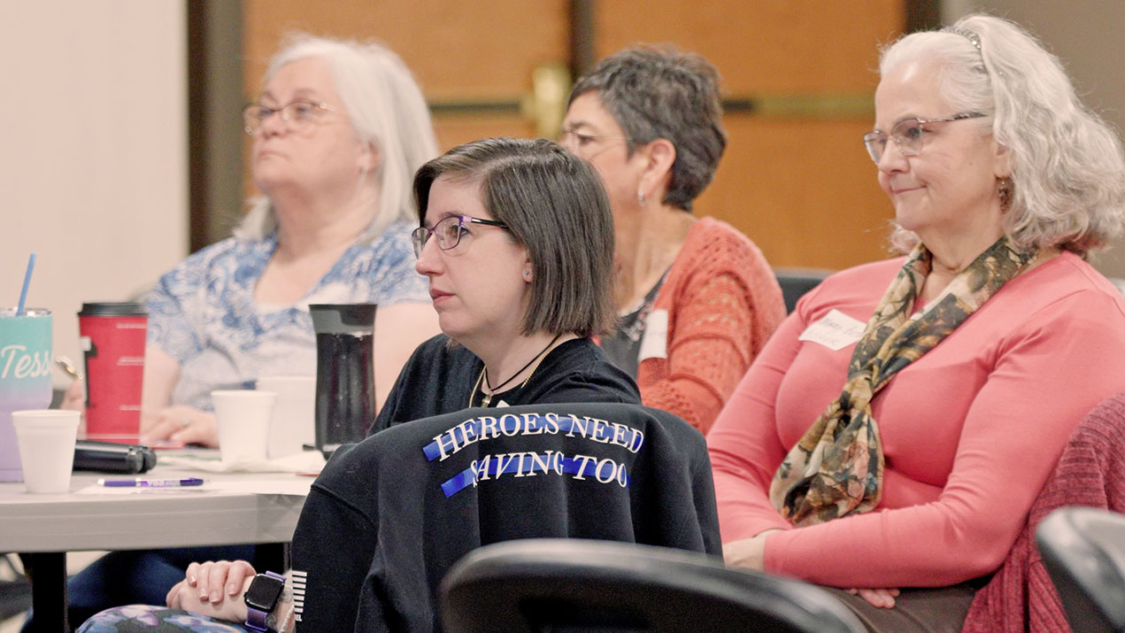 Women listening at a meeting