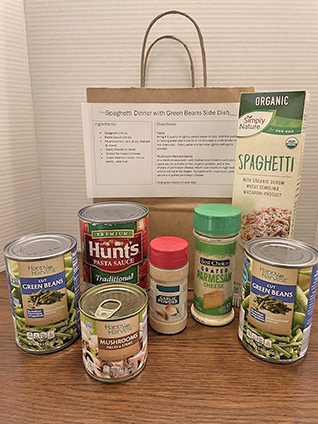 Spaghetti meal kit with pasta, sauce, and green beans