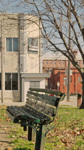 Park bench in front of brick building