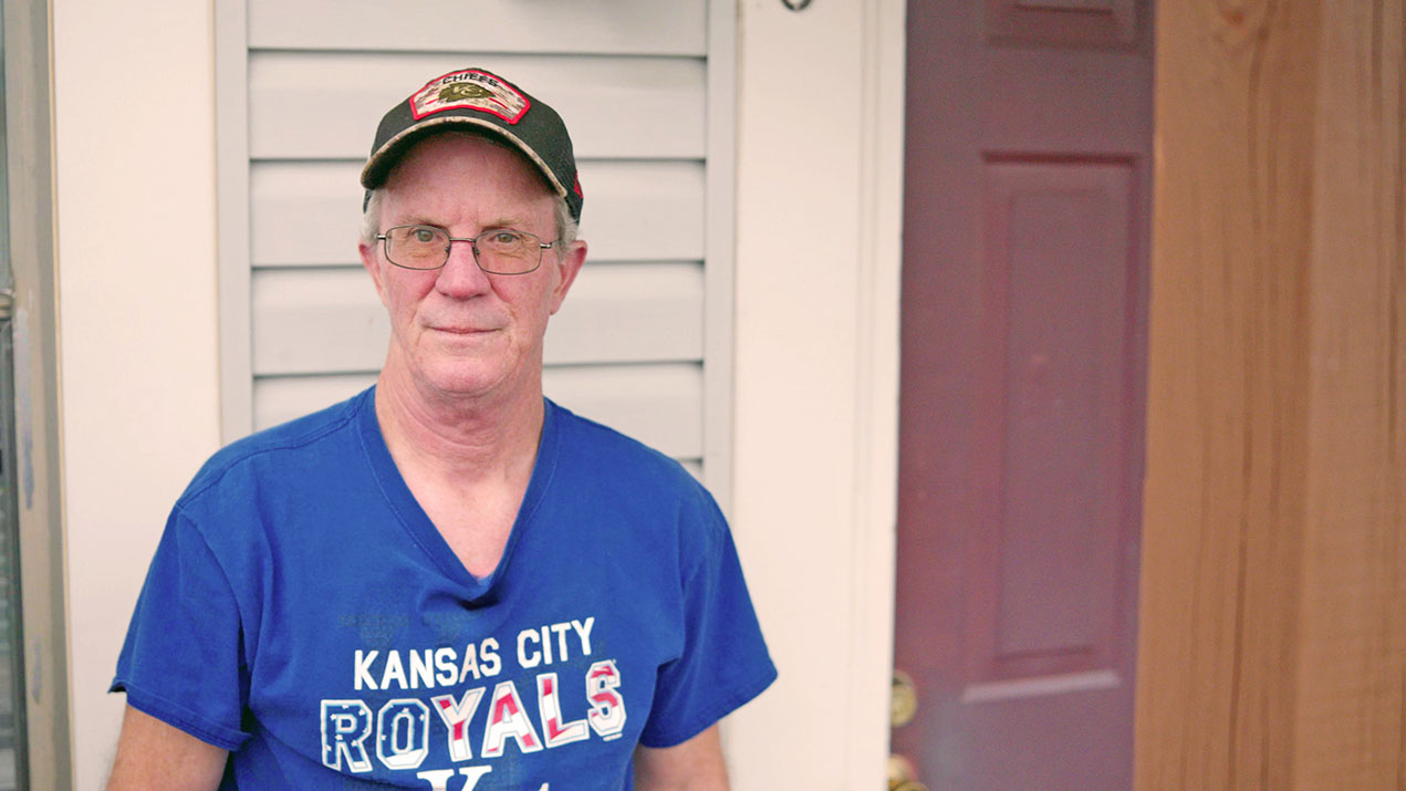 Man in Kansas City Royals shirt