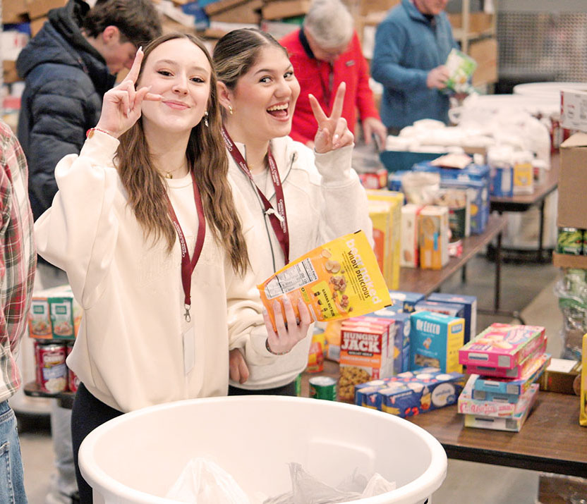 Volunteers packing food donations