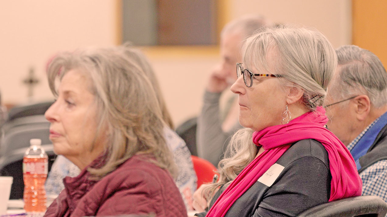 Women listening intently at a meeting